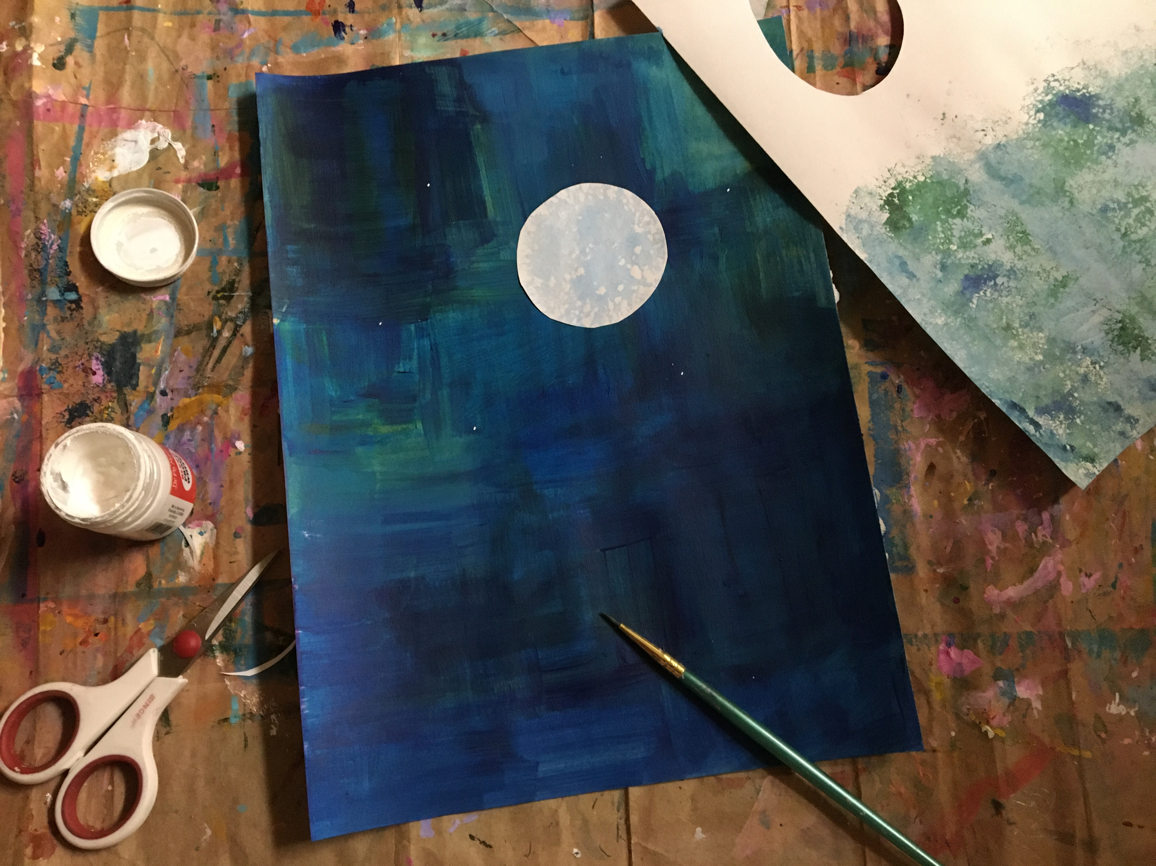 acrylic painted background with a blue boon in Eric Carle style