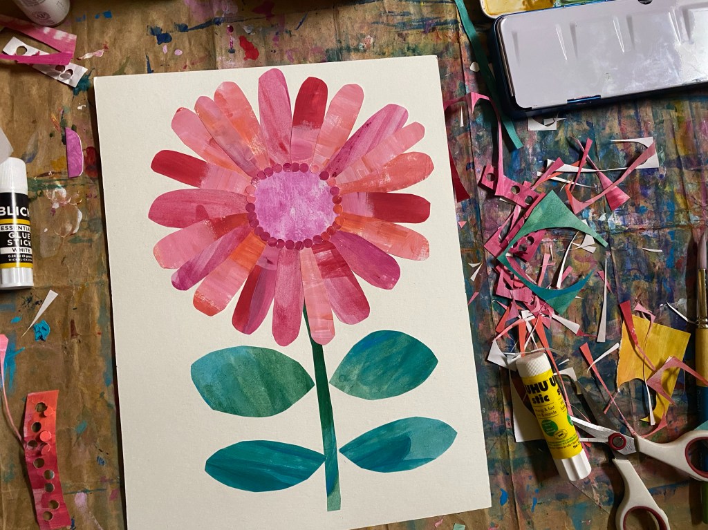 A large flower made from various tones of pink