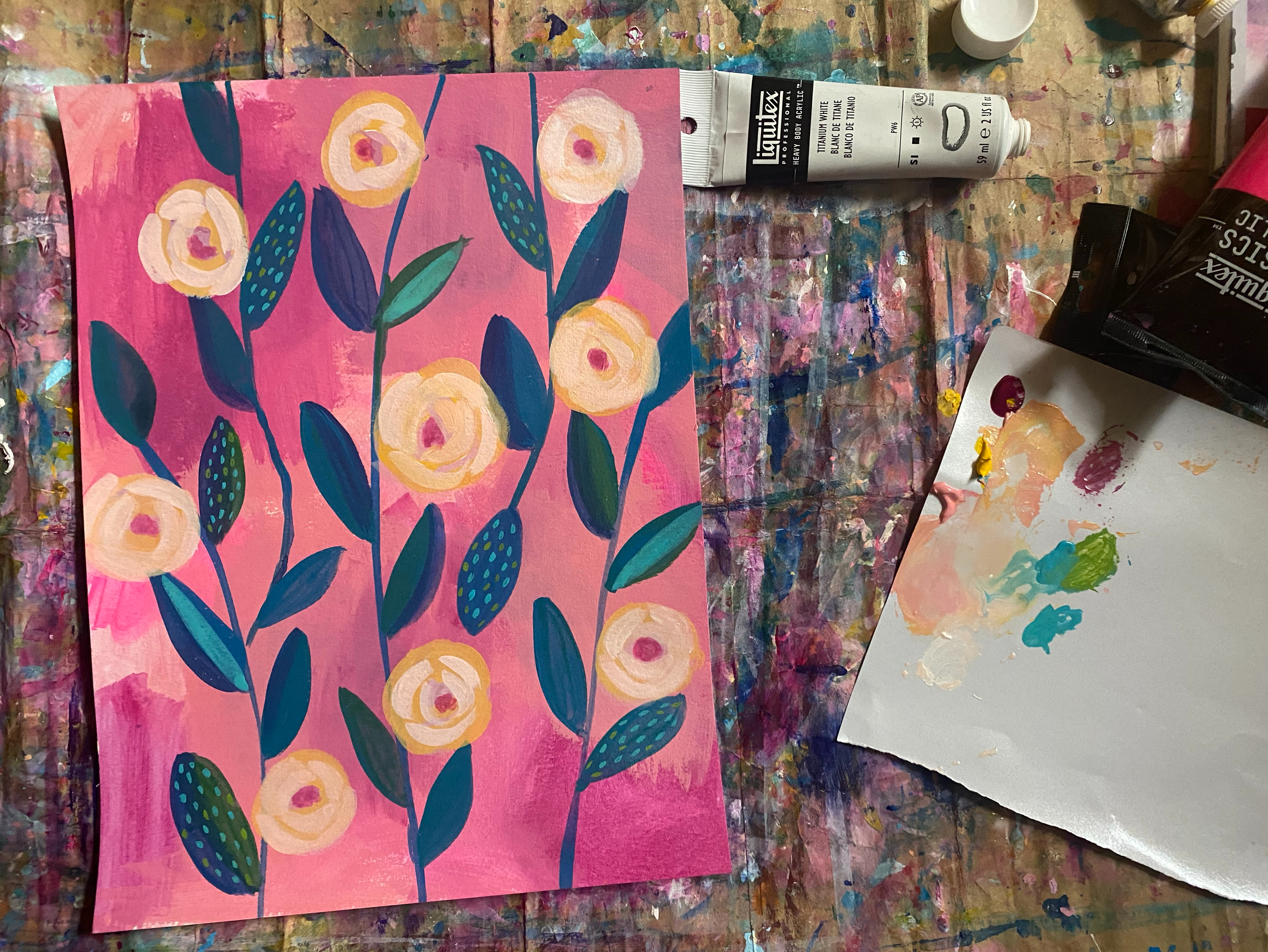 peach and pink blooms on blue leaf botanicals