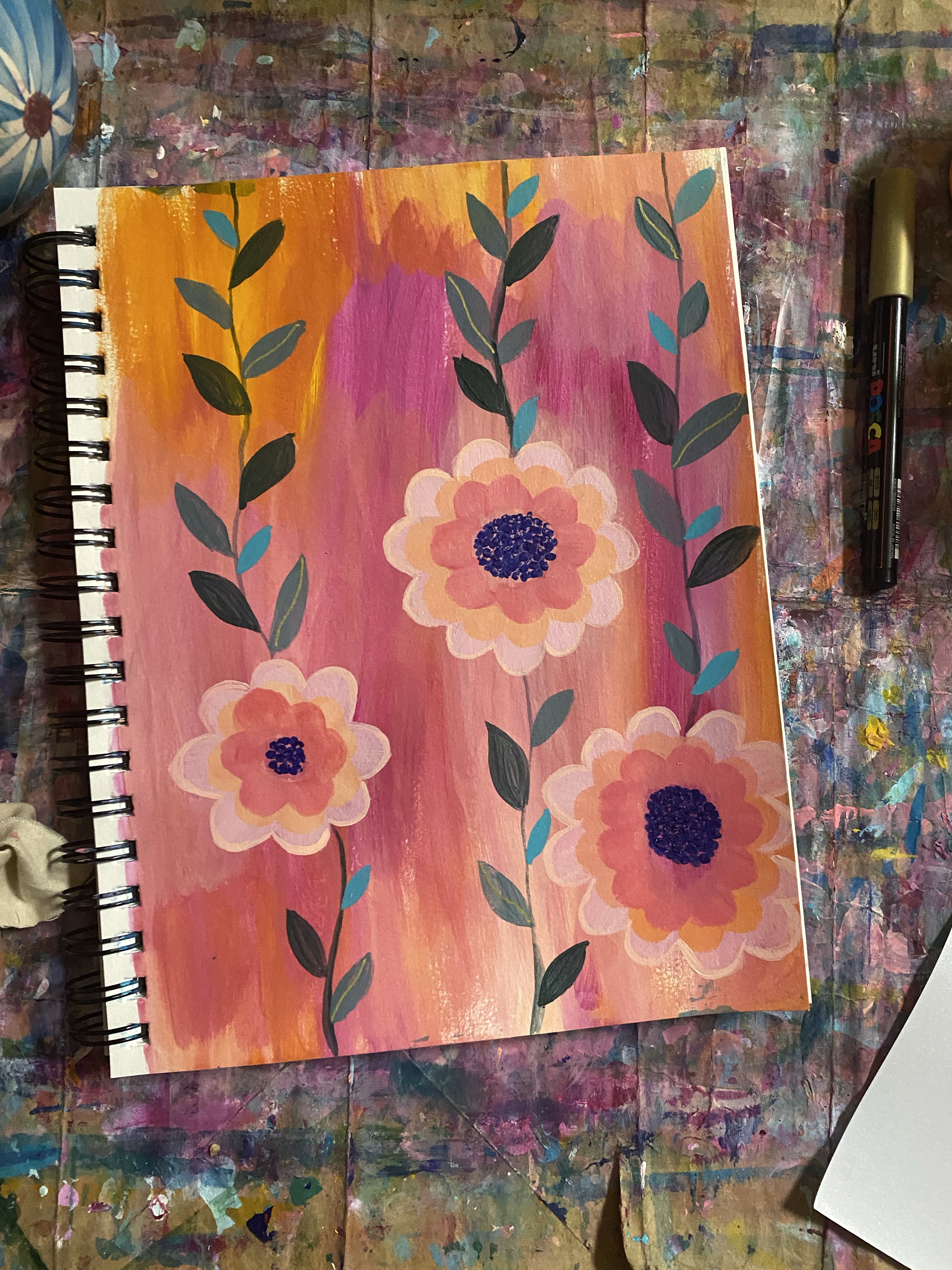 Three flower vines on a orange and pink background