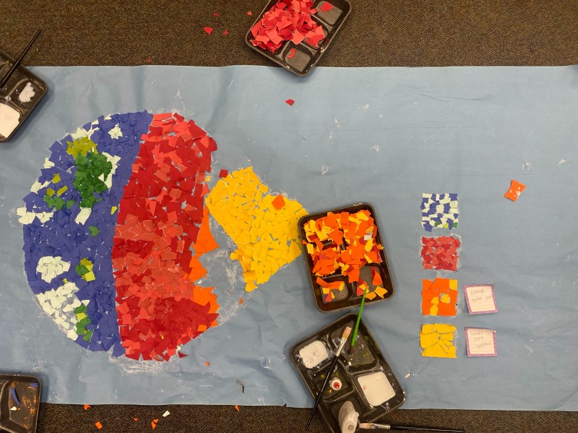 a paper collage poster of earth's layers