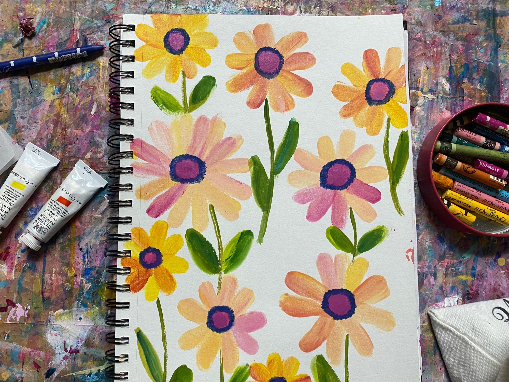 A pattern of yellow and paint finger painted flowers