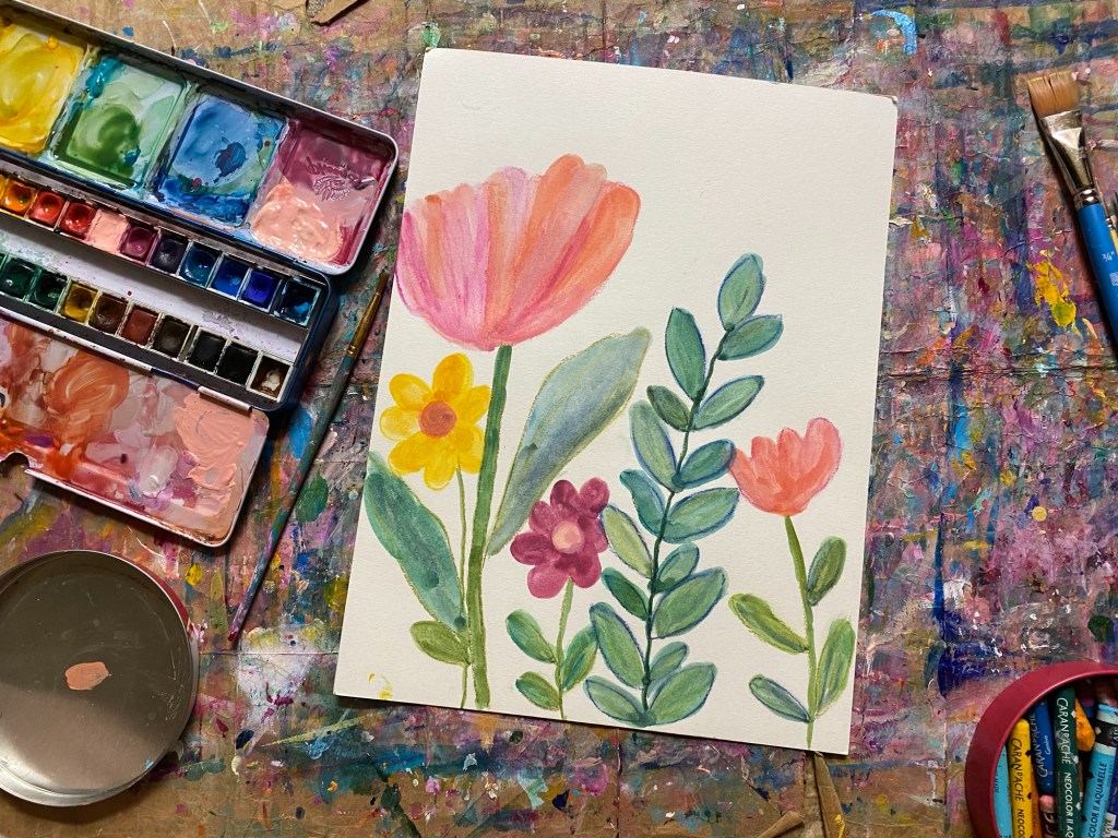 Five flowers finger painted with watercolor