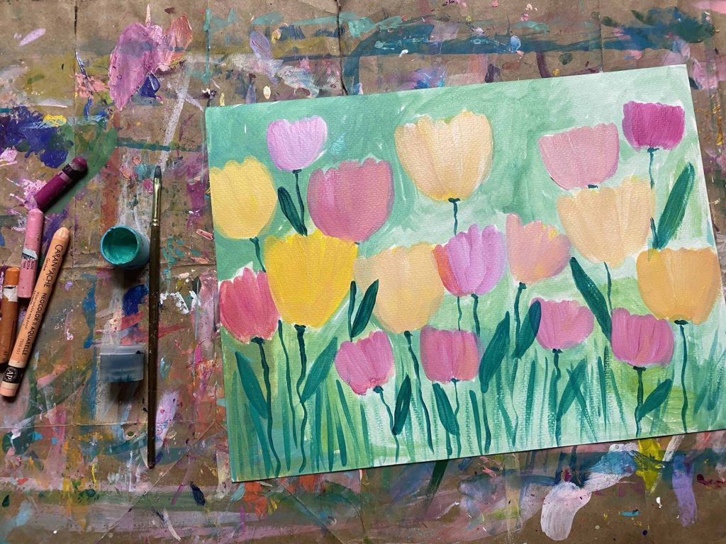 Field of lovely abstract tulips in yellow, pink and peach