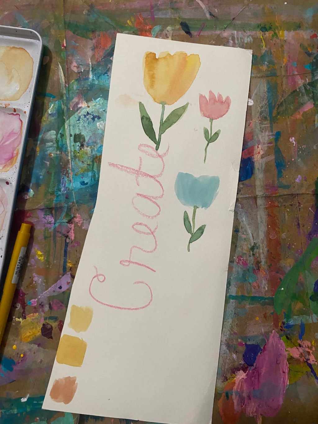 a strip of watercolor paper with flowers for a pattern